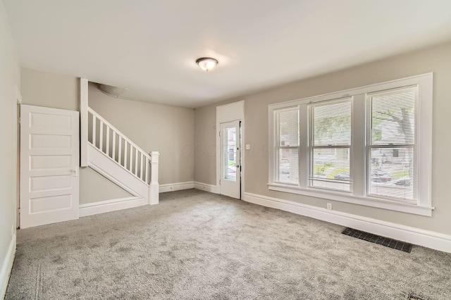 53 N Warren Ave, Columbus, OH 43204 - carpeted entryway with stairway, plenty of natural light, and baseboards