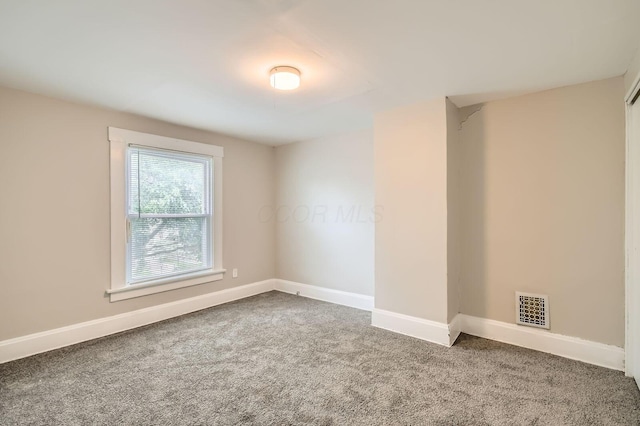 53 N Warren Ave, Columbus, OH 43204 - spare room featuring carpet floors and baseboards