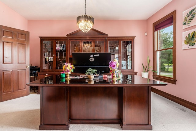 home office featuring light colored carpet and a notable chandelier