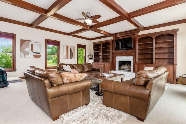 carpeted living room featuring beam ceiling, ceiling fan, and coffered ceiling