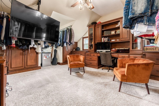 home office with light carpet, vaulted ceiling, and ceiling fan