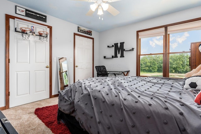 carpeted bedroom with ceiling fan