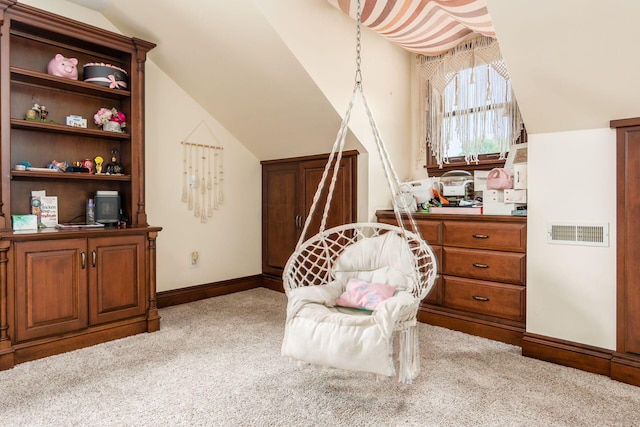 living area featuring light colored carpet and vaulted ceiling