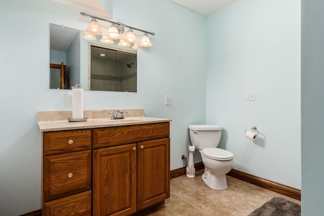 bathroom with tile patterned floors, vanity, toilet, and walk in shower