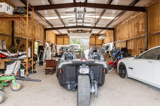 garage featuring wooden walls