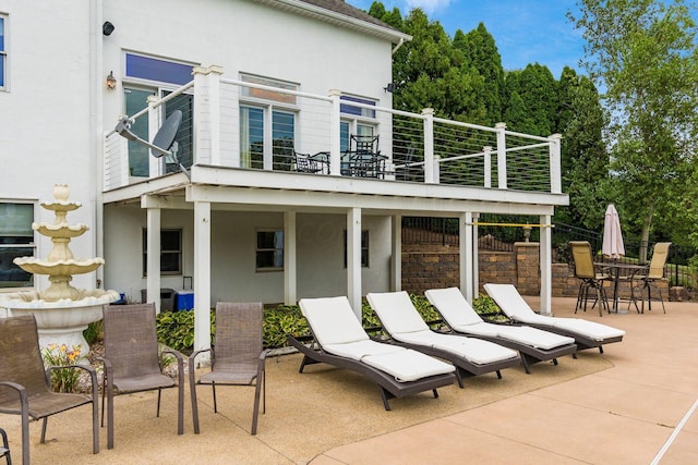 view of patio with a balcony