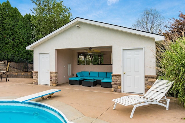 exterior space featuring an outdoor hangout area, ceiling fan, and a patio area