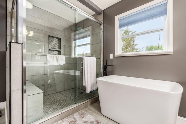 bathroom featuring plus walk in shower and tile patterned floors