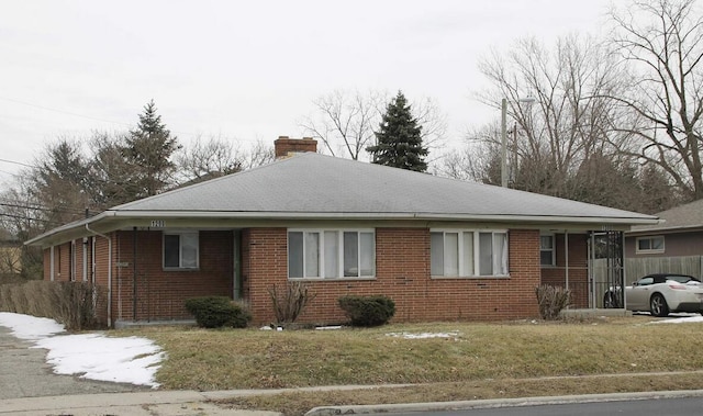 view of side of home featuring a yard