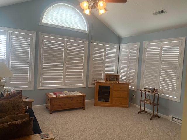 living area with a baseboard radiator, vaulted ceiling, ceiling fan, and light colored carpet