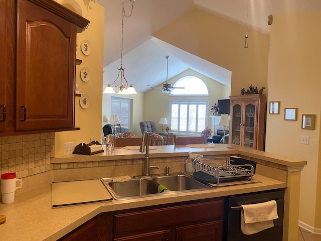 kitchen featuring pendant lighting, dishwasher, ceiling fan with notable chandelier, sink, and kitchen peninsula