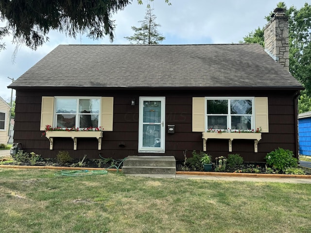 view of front of home with a front yard