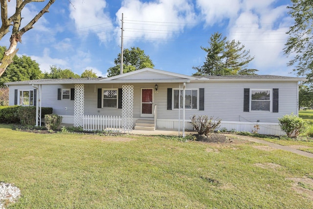 view of front facade with a front lawn and covered porch