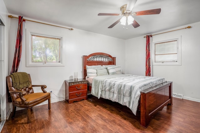 bedroom featuring dark hardwood / wood-style flooring and ceiling fan