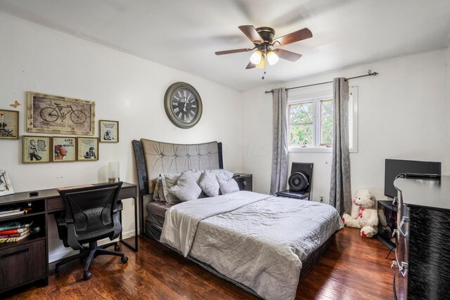 bedroom with ceiling fan and dark hardwood / wood-style floors