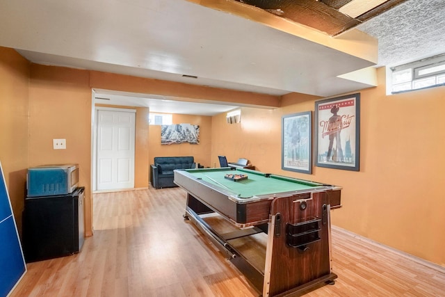 game room with light hardwood / wood-style floors and pool table