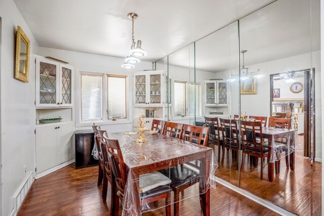 dining area with dark wood-type flooring