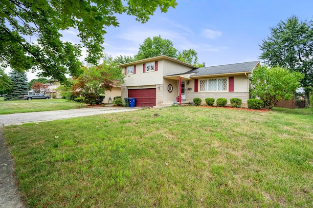 split level home with a garage and a front yard