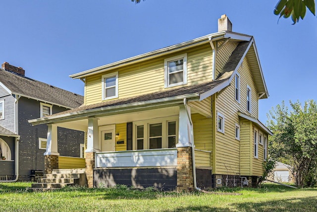75 N Huron Ave, Columbus, OH 43204 - view of front of house featuring covered porch and a chimney