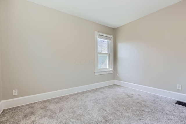 75 N Huron Ave, Columbus, OH 43204 - carpeted empty room with baseboards