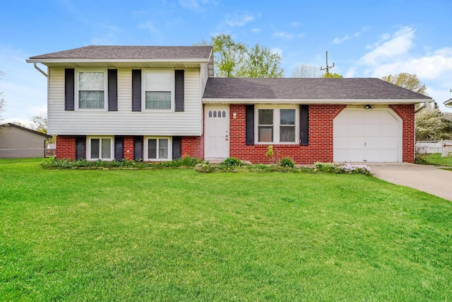 tri-level home featuring a garage and a front lawn