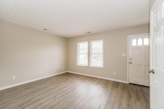 entrance foyer with light wood-type flooring and a wealth of natural light