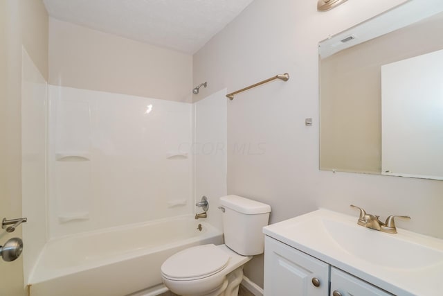 full bathroom with a textured ceiling, vanity,  shower combination, and toilet