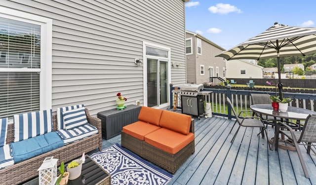 deck featuring outdoor lounge area and area for grilling