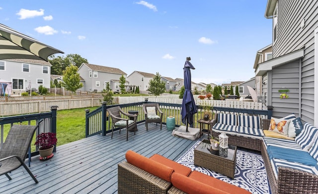 wooden terrace with an outdoor living space