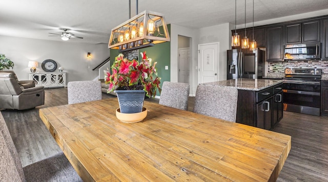 dining room featuring ceiling fan and dark hardwood / wood-style floors