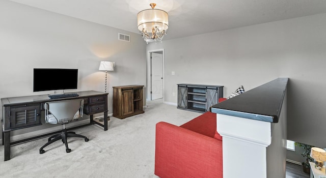 carpeted home office featuring a notable chandelier