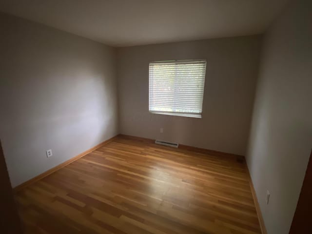 empty room featuring hardwood / wood-style flooring