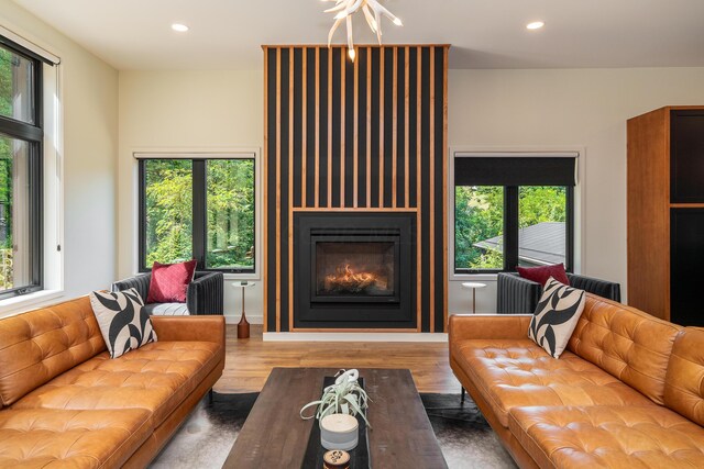 living room with a fireplace, hardwood / wood-style floors, and a wealth of natural light