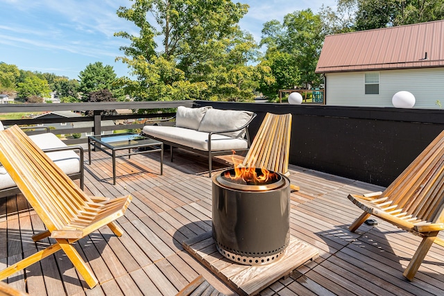 wooden deck featuring an outdoor living space