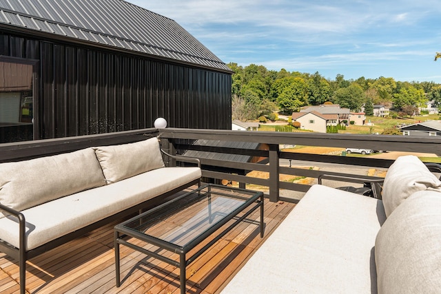 wooden terrace featuring an outdoor living space