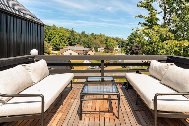 wooden terrace featuring outdoor lounge area