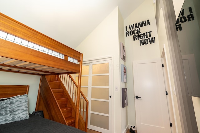 staircase featuring vaulted ceiling