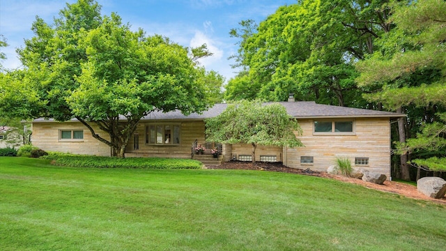 view of front of property with a front lawn