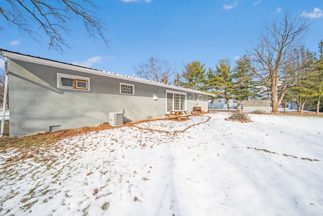 view of snow covered house