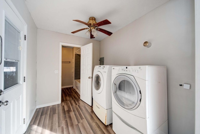 washroom featuring washer and dryer, dark wood-type flooring, and ceiling fan