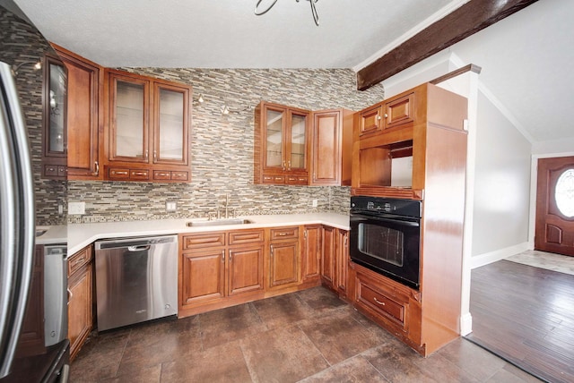 kitchen featuring stainless steel appliances, sink, backsplash, and lofted ceiling with beams