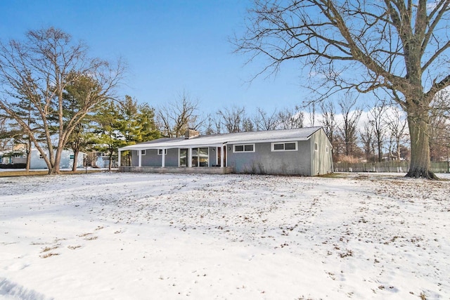 view of front of house featuring a sunroom