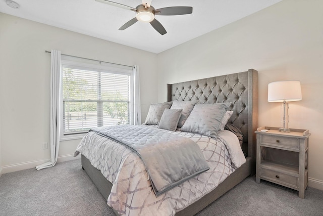 bedroom featuring light colored carpet and ceiling fan