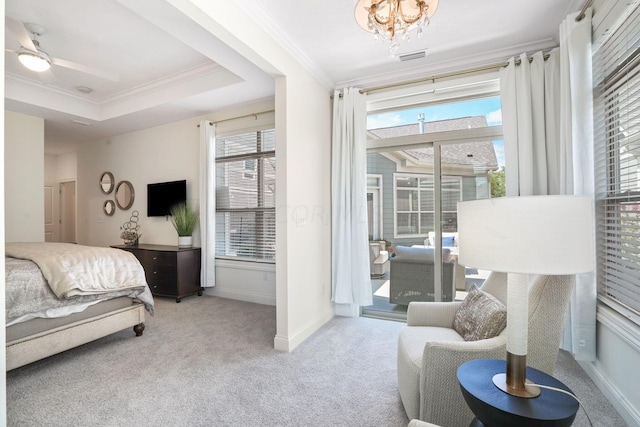 carpeted bedroom with a raised ceiling, ceiling fan with notable chandelier, access to exterior, and crown molding