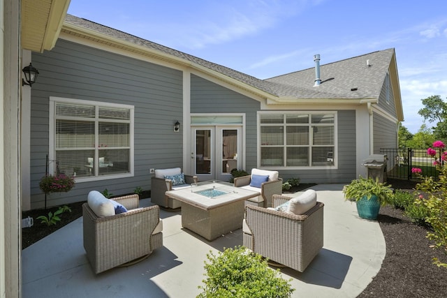 view of patio / terrace with french doors, an outdoor living space with a fire pit, and a grill