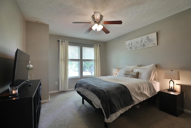 bedroom with carpet, ceiling fan, and a textured ceiling