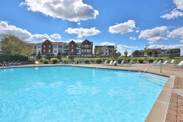 view of swimming pool featuring a patio area