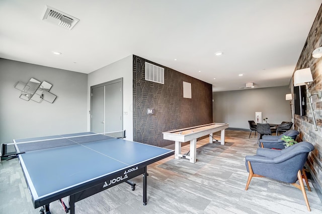 recreation room with light wood-type flooring