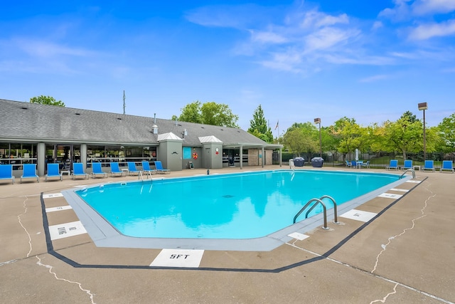 view of swimming pool featuring a patio