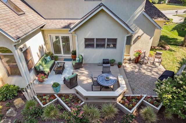 back of house with an outdoor living space, stucco siding, roof with shingles, and a wooden deck